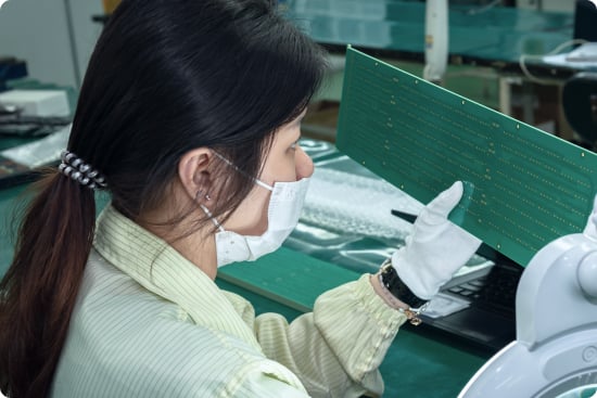 Operator doing PCB inspection